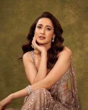 Dazzling Pragya Jaiswal in an Ivory Shimmer Tulle Saree Gown with Silver Sequins and Pearl Embroidery Photos 02