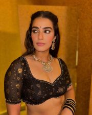 Double iSmart Heroine Kavya Thapar in a Sexy Black Lehenga Pictures 03