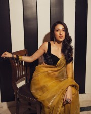 Dreamy Beauty Neha Shetty in a Golden Saree with Black Sleeveless Blouse Photos 03