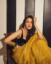 Dreamy Beauty Neha Shetty in a Golden Saree with Black Sleeveless Blouse Photos 07