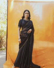 Elegant Actress Mrunal Thakur in a Black Gold Border Chiffon Saree Photos 01