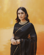 Elegant Actress Mrunal Thakur in a Black Gold Border Chiffon Saree Photos 03