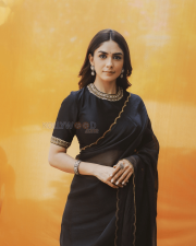 Elegant Actress Mrunal Thakur in a Black Gold Border Chiffon Saree Photos 05