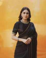 Elegant Actress Mrunal Thakur in a Black Gold Border Chiffon Saree Photos 05