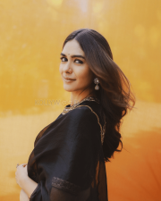 Elegant Actress Mrunal Thakur in a Black Gold Border Chiffon Saree Photos 06
