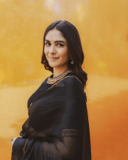 Elegant Actress Mrunal Thakur in a Black Gold Border Chiffon Saree Photos 07
