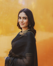 Elegant Actress Mrunal Thakur in a Black Gold Border Chiffon Saree Photos 07