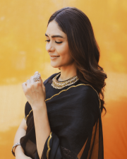 Elegant Actress Mrunal Thakur in a Black Gold Border Chiffon Saree Photos 08