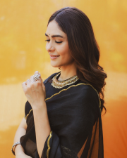 Elegant Actress Mrunal Thakur in a Black Gold Border Chiffon Saree Photos 08