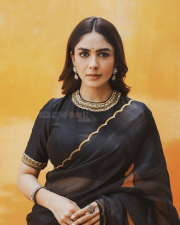 Elegant Actress Mrunal Thakur in a Black Gold Border Chiffon Saree Photos 09