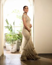 Elegant Actress Mrunal Thakur in a Ivory Embellished Ruffle Saree Photos 01