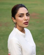 Elegant Actress Sobhita Dulipala in a white kurta with pink floral accents Photos 03