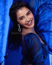 Elegant Anupama Parameswaran in a Blue and Black Printed Saree Photos 05