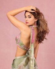 Elegant Beauty Saiee Manjrekar in a Vibrant Floral Green and Pink Saree with a Sleeveless Blouse Photos 02