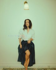 Enchanting Actress Elli AvrRam in a White Cropped Shirt and Black Satin Maxi Skirt Photos 05