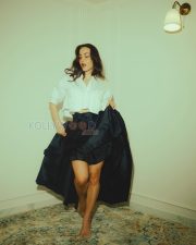 Enchanting Actress Elli AvrRam in a White Cropped Shirt and Black Satin Maxi Skirt Photos 06