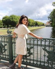 Enchanting Actress Shriya Saran in a Cream Floral Strapless Mini Dress Photos 02