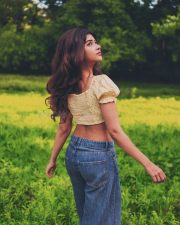Enchanting Actress Srijita Ghosh in a yellow polka dot off shoulder crop top and denim photos 17