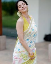 Enchanting Actress Vedhika in a White floral printed saree with yellow halter blouse Photos 02 Enchanting Actress Vedhika in a White floral printed saree with yellow halter blouse Photos 02