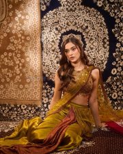 Ghani Heroine Saiee Manjrekar in a Green Red Gold Satin Silk Saree with an Embroidered Sleeveless Blouse Pictures 05