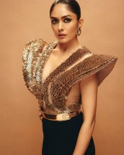 Glam Mrunal Thakur in a Golden Metallic TOp with a Black Thigh Slit Gown Photos 02