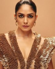 Glam Mrunal Thakur in a Golden Metallic TOp with a Black Thigh Slit Gown Photos 04