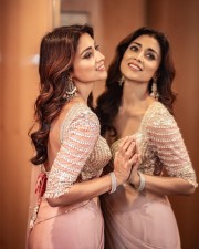 Glamour Hottie Shriya Saran in a Pink Net Saree with Cleavage Neckline Photos 03