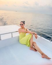 Glowing Pragya Jaiswal in a Lime Yellow Knit Maxi Dress with a Thigh Slit and Bust Cutout Photos 05