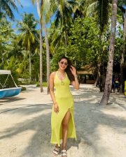 Glowing Pragya Jaiswal in a Lime Yellow Knit Maxi Dress with a Thigh Slit and Bust Cutout Photos 07