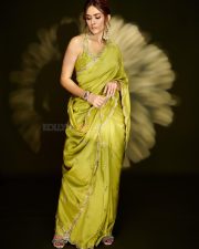 Gorgeous Mrunal Thakur in a Lime Green Silk Saree with a Sleeveless Cropped Blouse Pictures 09