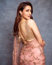 Gorgeous Pragya Jaiswal in a Peach Saree at Daaku Maharaaj Success Press Meet in Hyderabad Photos 04