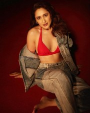 Gorgeous Pragya Jaiswal in a Trendy Denim Jacket and Red Bra Photos 02