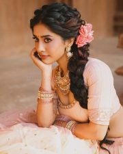 Graceful Actress Nabha Natesh in a blush pink and gold beaded saree blouse crop top with flowing pallu photos 09