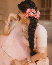 Graceful Actress Nabha Natesh in a blush pink and gold beaded saree blouse crop top with flowing pallu photos 16