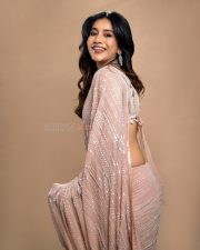 Graceful Actress Nabha Natesh in an ornate gold and magenta embroidered cream lehenga with gold jewelry photos 08