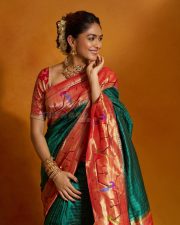 Hai Jawani Toh Ishq Hona Hai Actress Mrunal Thakur in a Traditional Maharashtrian Paithani Silk Saree with a Short Sleeved Red Blouse Pictures 05