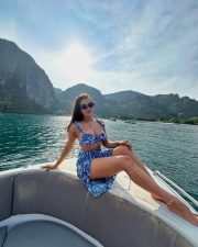 Hot Kavya Thapar in a Blue Floral Beach Bikini Photos 04