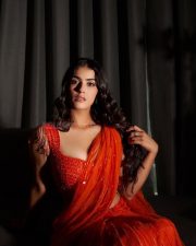 Hot and Curvy Kavya Thapar Cleavage and Navel in an Orange Saree with a Deep Neck Blouse Photos 02
