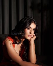 Hot and Curvy Kavya Thapar Cleavage and Navel in an Orange Saree with a Deep Neck Blouse Photos 03