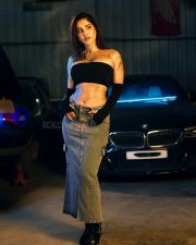 Impressive Nabha Natesh in a Black Tube Top with a Denim Skirt in a Car Garage Photos 04