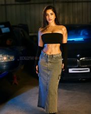 Impressive Nabha Natesh in a Black Tube Top with a Denim Skirt in a Car Garage Photos 06