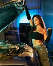 Impressive Nabha Natesh in a Black Tube Top with a Denim Skirt in a Car Garage Photos 07