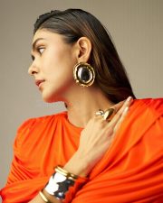 Made in Heaven 2 Actress Mrunal Thakur in an Amber Orange Ruched Dress Stills 04