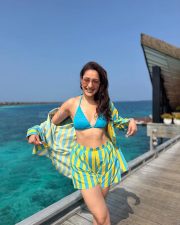 Main Chala Actress Pragya Jaiswal in a Bold Blue and Yellow Striped Shirt and Shorts with a Blue Triangle Bikini Top Pictures 03