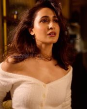 Mesmerizing Actress Pragya Jaiswal in a White Off Shoulder Fuzzy Crop Sweater Photos 02