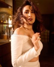 Mesmerizing Actress Pragya Jaiswal in a White Off Shoulder Fuzzy Crop Sweater Photos 04