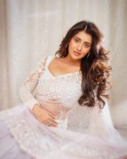Mesmerizing Actress Rashi Singh in a White Embroidered Lehenga Photos 08