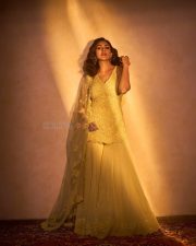 Mesmerizing Bollywood Actress Mrunal Thakur in a Yellow Embroidered Sharara Photos 01