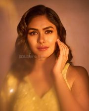 Mesmerizing Bollywood Actress Mrunal Thakur in a Yellow Embroidered Sharara Photos 02