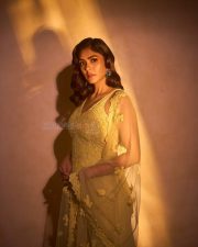 Mesmerizing Bollywood Actress Mrunal Thakur in a Yellow Embroidered Sharara Photos 08
